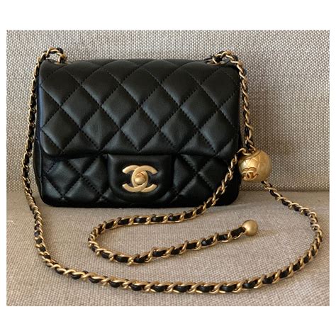 chanel purse black small|Chanel small purse with chain.